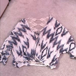 Blouse with an open crochet back